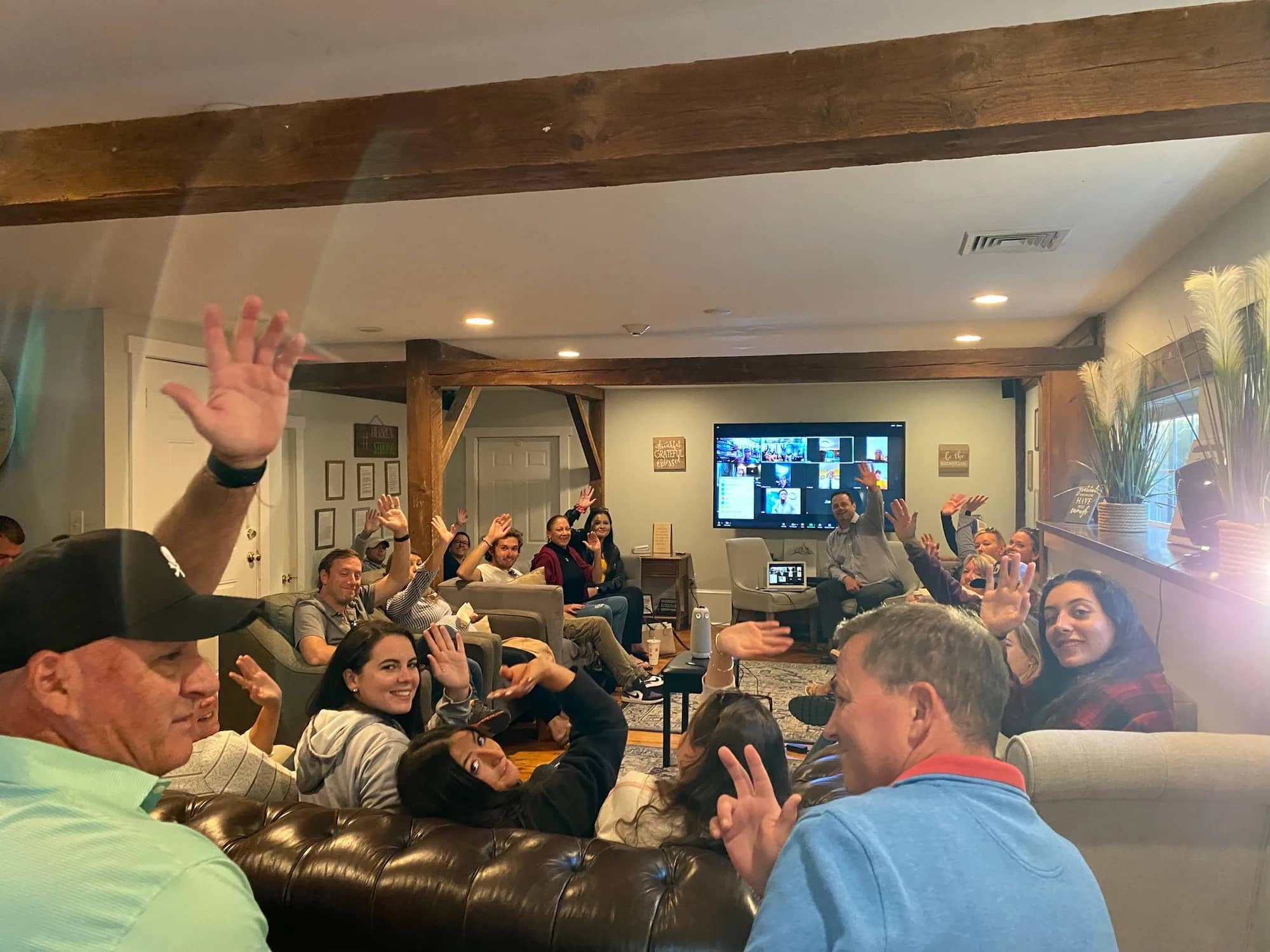 Herren Wellness alumni gathered in a living room