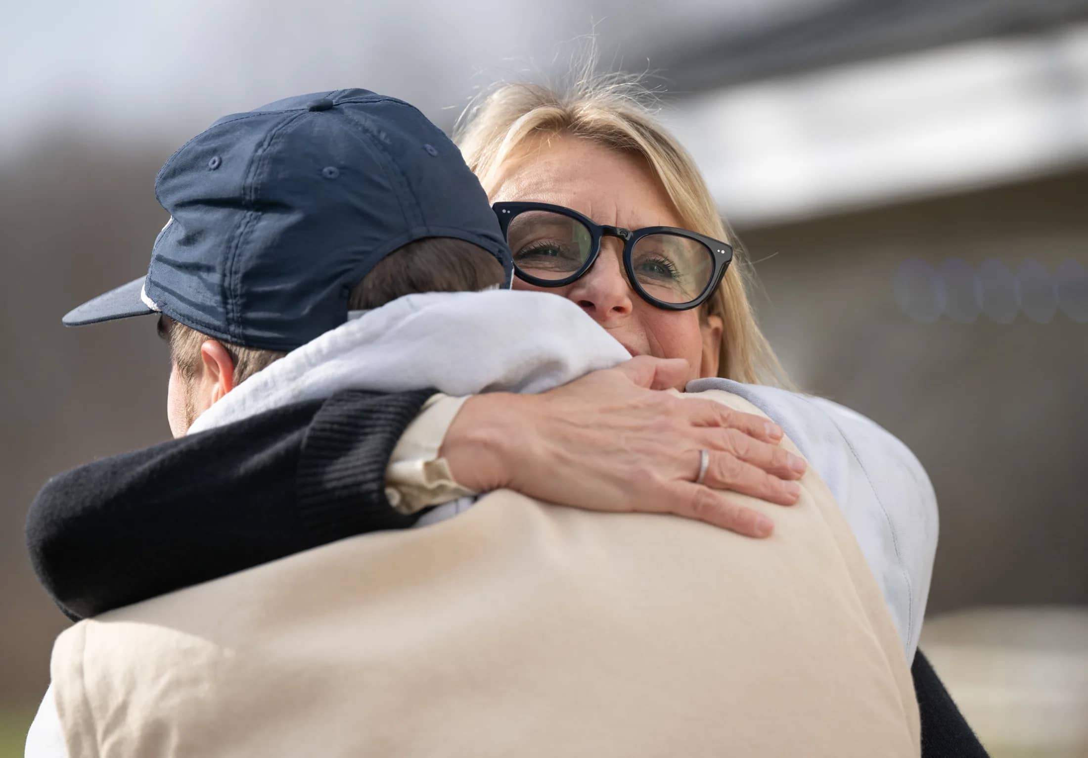 Lori McCarthy hugging a Herren Wellness guest
